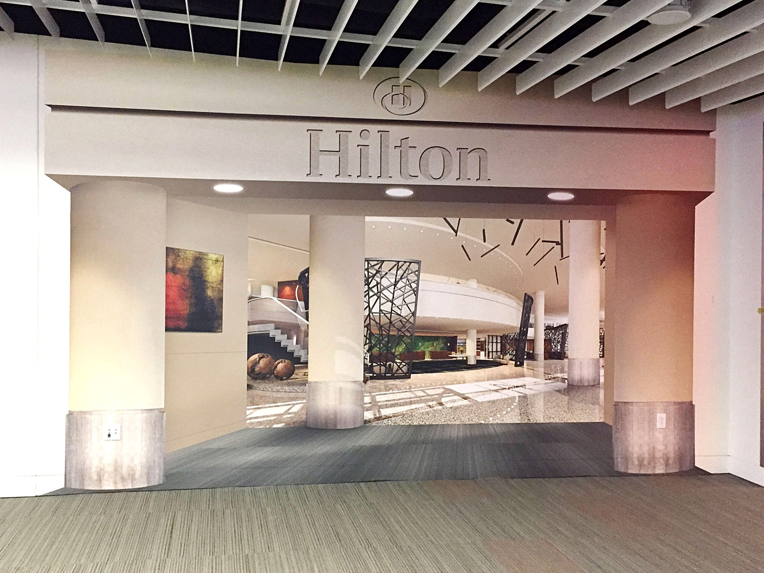 Wall Decal and signage installed in the Hilton Hotel entrance