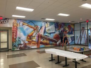 Customized Wide format printing on a vinyl wall covering to create a statement piece for a clients cafeteria.